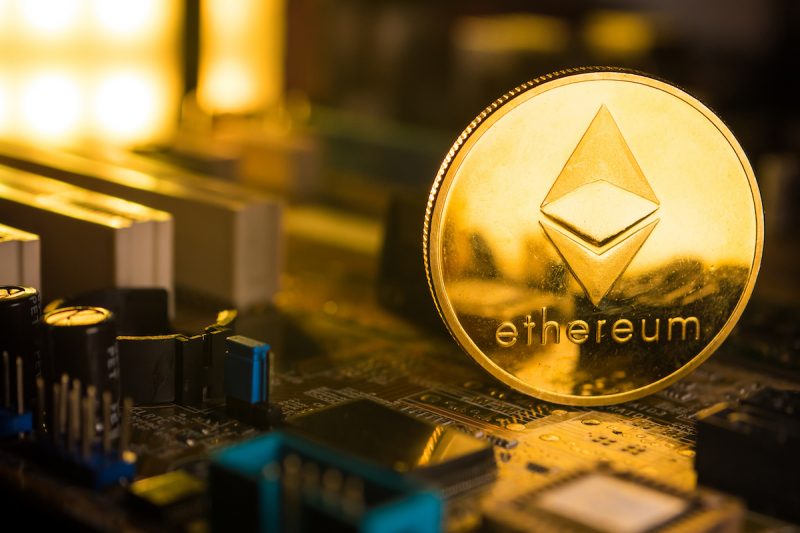 a-golden-coin-with-ethereum-symbol-on-a-mainboard-2021-09-04-07-23-21-utc.jpg